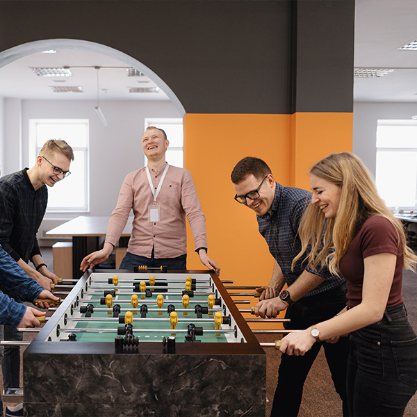 employees playing ping pong